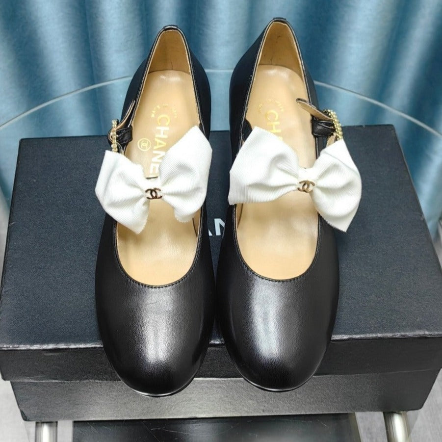 HIGH MARY JANE SHOES BLACK SHEEPSKIN WITH WHITE BOW