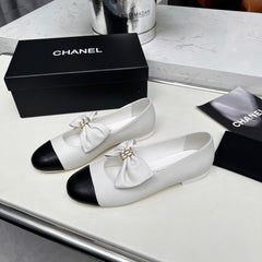 CHANEL 25S MARY JANES IN WHITE MIX BLACK CALFSKIN WITH BOW GOLD HARDWRE