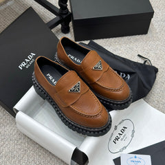 PRADA 25S LOAFER 50MM IN BURNT ORANGE CALFSKIN LOGO