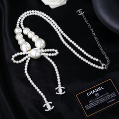CHANEL 25S CHAIN BELT IN WHITE PEARL WITH BOW 614475
