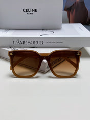 TRIOMPHE SUNGLASSES 552774 IN CARAMEL ACETATE TEXT LOGO