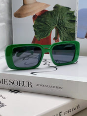 MONTAIGNE SUNGLASS 571594 IN GREEN ACETATE TEXT LOGO