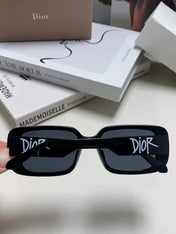 MONTAIGNE SUNGLASS 571596 IN BLACK ACETATE TEXT LOGO