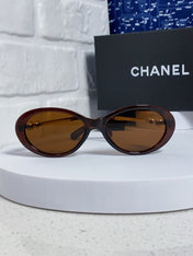 OVAL SUNGLASSES 640342 IN BROWN CLEAR ACETATE METAL FRAME