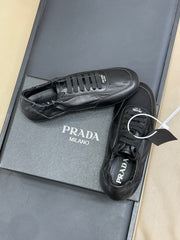 PRADA 25S COLLAPSE FLAT SHOES IN BLACK CALFSKIN