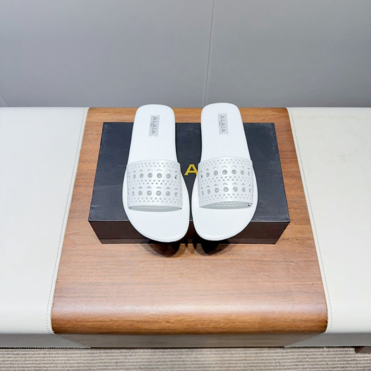ALAIA FLAT SANDALS WITH PERFORATED STRAPS 25S IN WHITE LAMBSKIN