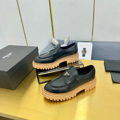 LOAFER WITH TRIANGLE LOGO IN BLACK CALFSKIN