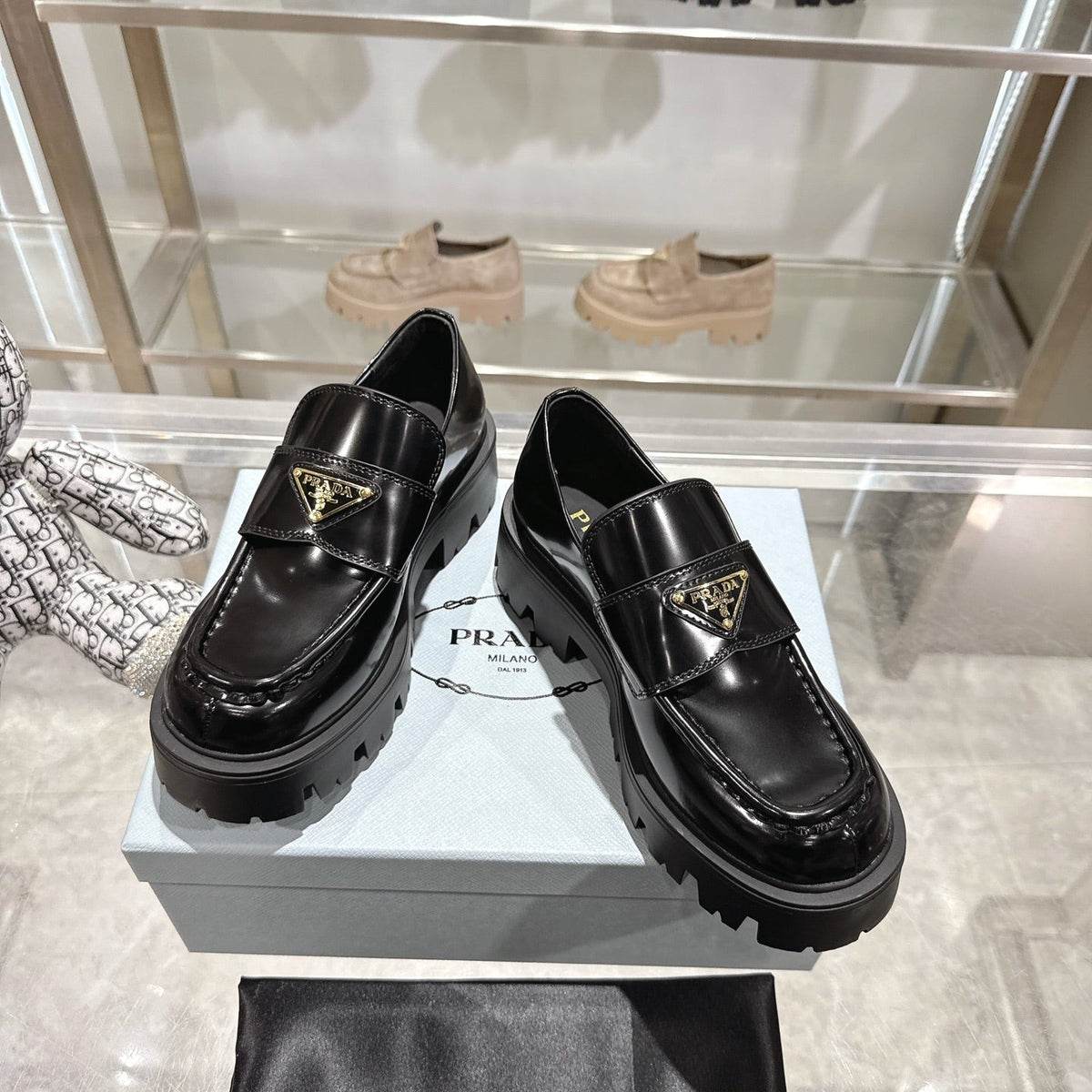 PRADA 25S THICK-SOLE LOAFERS 60 MM IN BLACK CALFSKIN