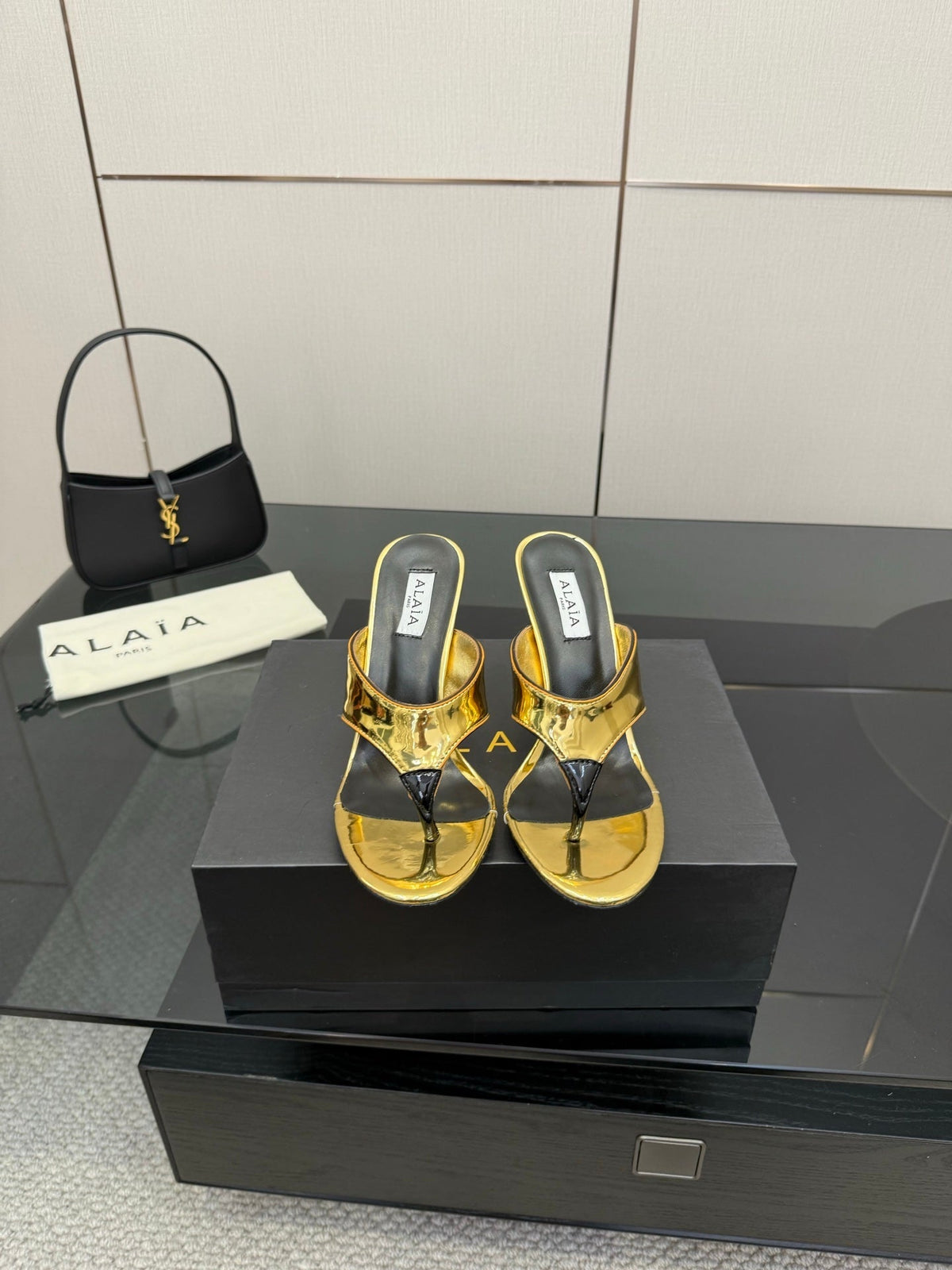ALAIA HEELED THONG 25S IN GOLD PATENT LEATHER